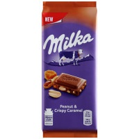 Шоколад Milka молочный с арахисом, кусочками хрустящей карамели 90г